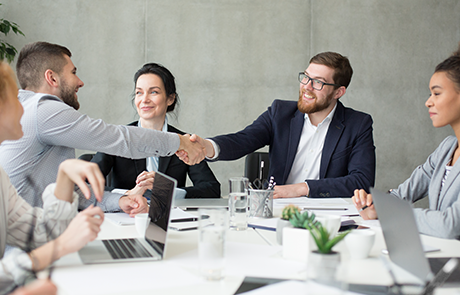 boss-shaking-hands-with-employee-at-meeting