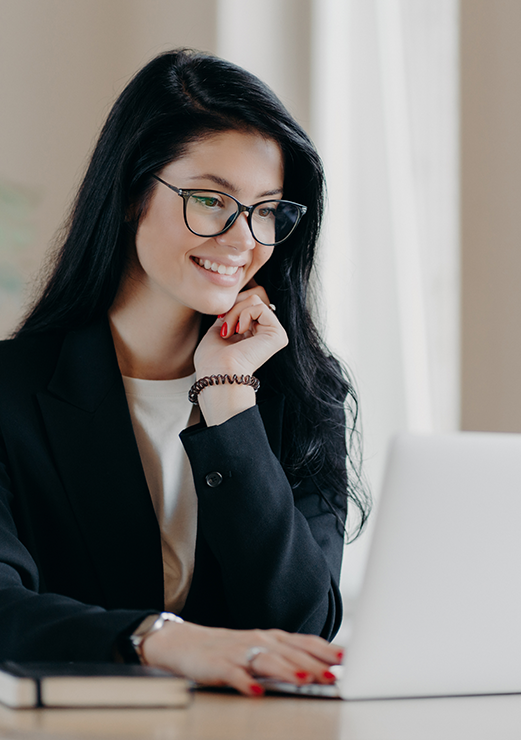 female-employee-types-on-laptop-computer