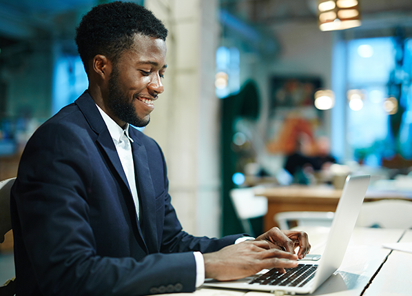 smiling-employee-with-laptop