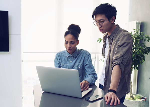 two-employees-staring-at-laptop